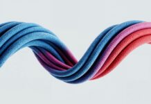 “계속 숨이 가쁘고 피곤해요”…초여름 ‘빈혈 증상’ 간과하지 마세요 Colorful, wavy cables intertwine against a white background.